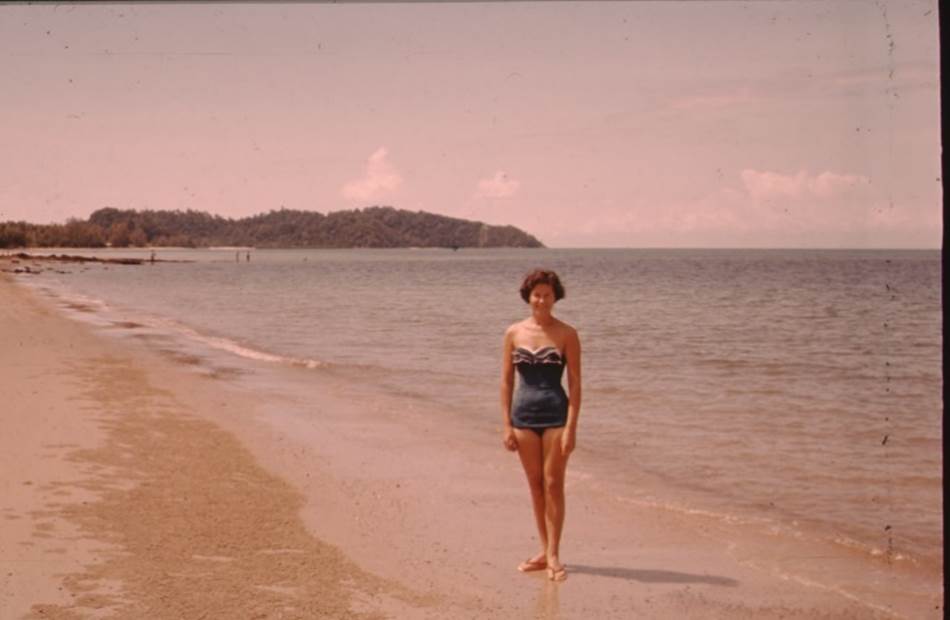 A person standing on a beach

Description automatically generated with medium confidence