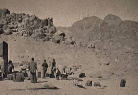 A group of people standing in a desert

Description automatically generated with medium confidence