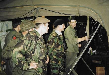 A group of soldiers in a tent

Description automatically generated with low confidence