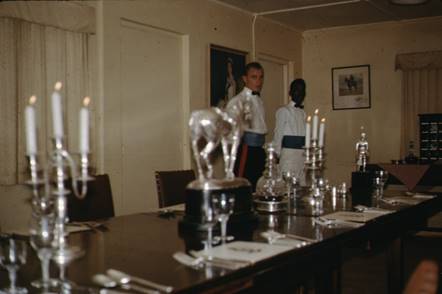 A group of people standing behind a table with candles on it

Description automatically generated with low confidence