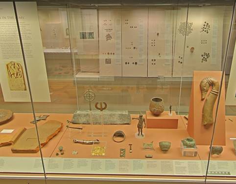 A display of ancient artifacts

Description automatically generated
