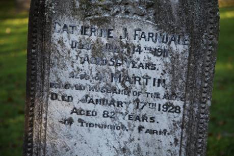 Close-up of a tombstone with a text

Description automatically generated