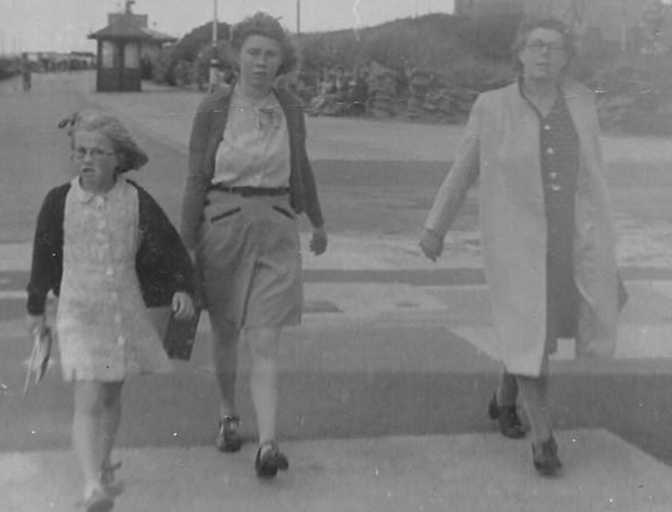 A couple of people walking

Description automatically generated