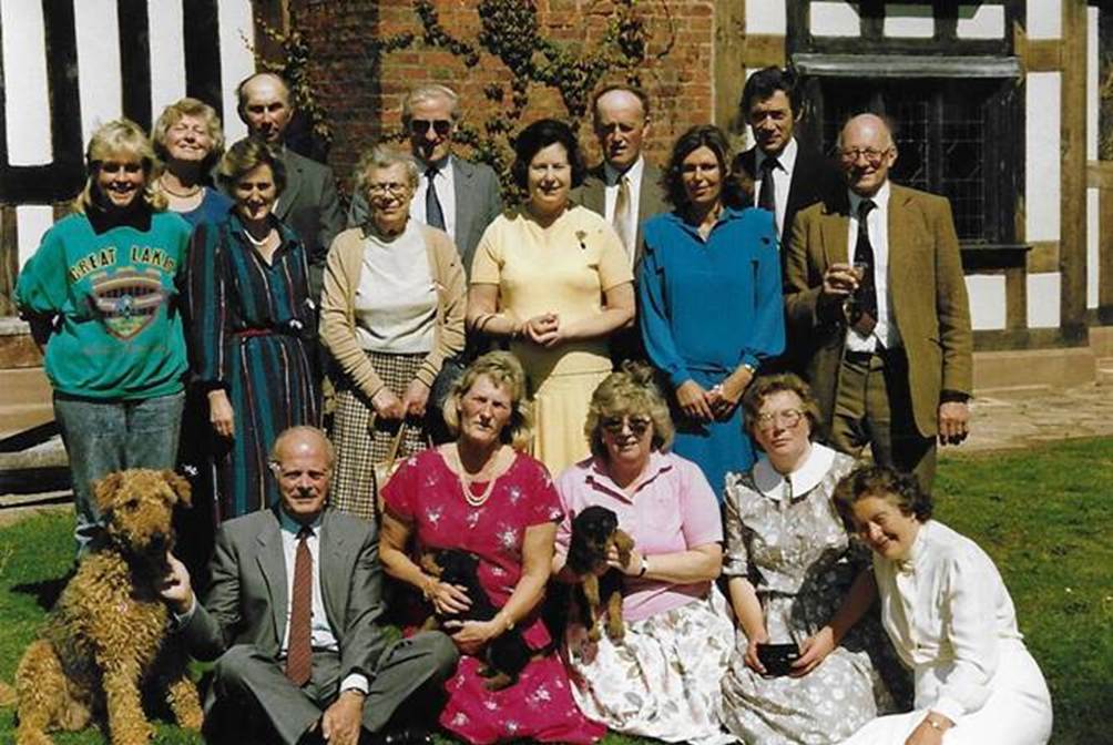 A group of people posing for a photo

Description automatically generated