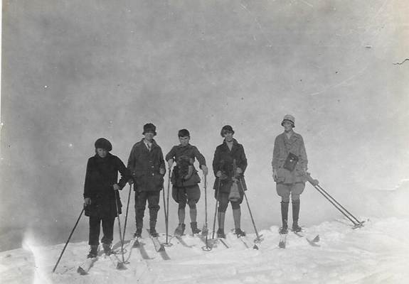 A group of people on skis
Description automatically generated