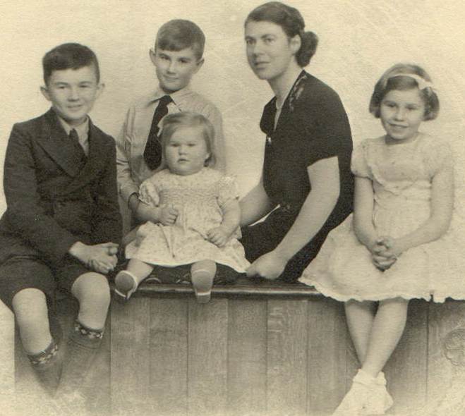 A group of people posing for a photo

Description automatically generated