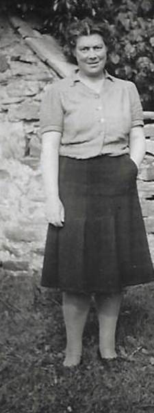 A black and white photo of a person
Description automatically generated