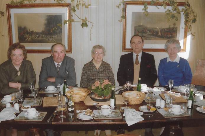 Several people sitting at a table
Description automatically generated