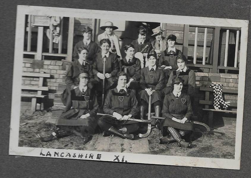 A black and white photo of a group of people
Description automatically generated