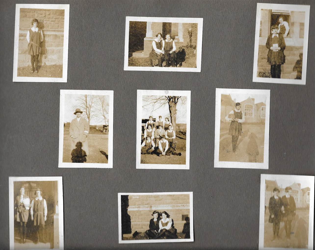 Several pictures on a grey wall
Description automatically generated