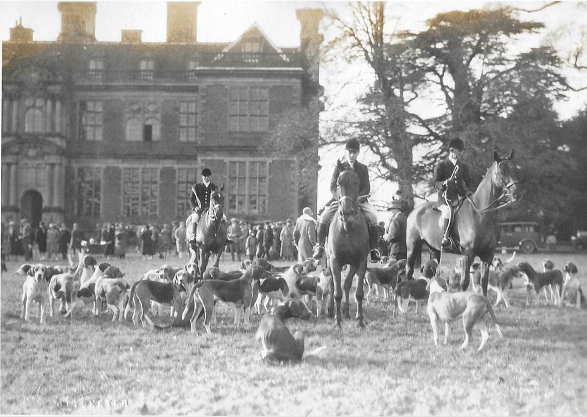 A black and white photo of people in a field
Description automatically generated