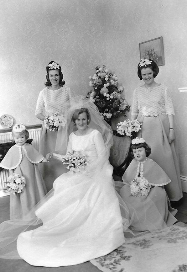 A group of women posing for a picture
Description automatically generated