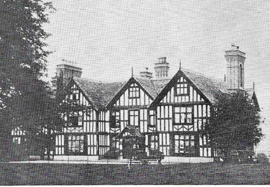 A black and white photo of a house
Description automatically generated