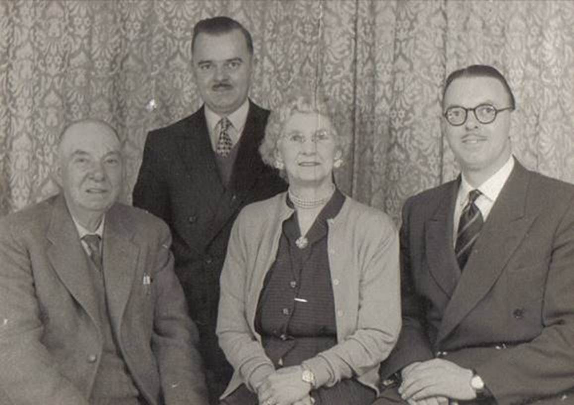 A group of people posing for a photo
Description automatically generated