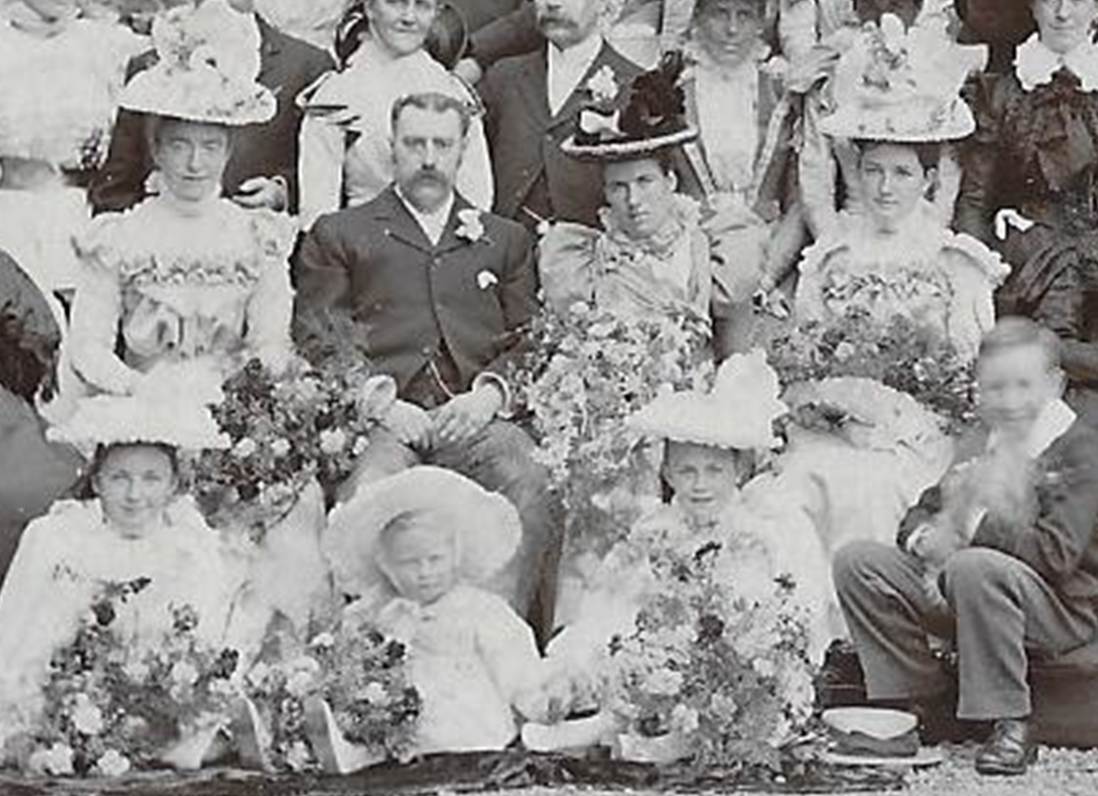 A group of people posing for a photo
Description automatically generated