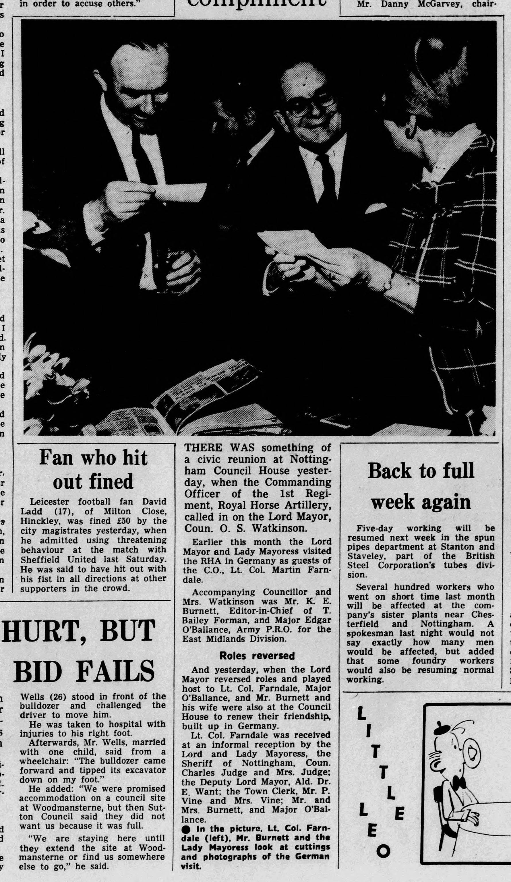 A newspaper article with a couple of men
Description automatically generated