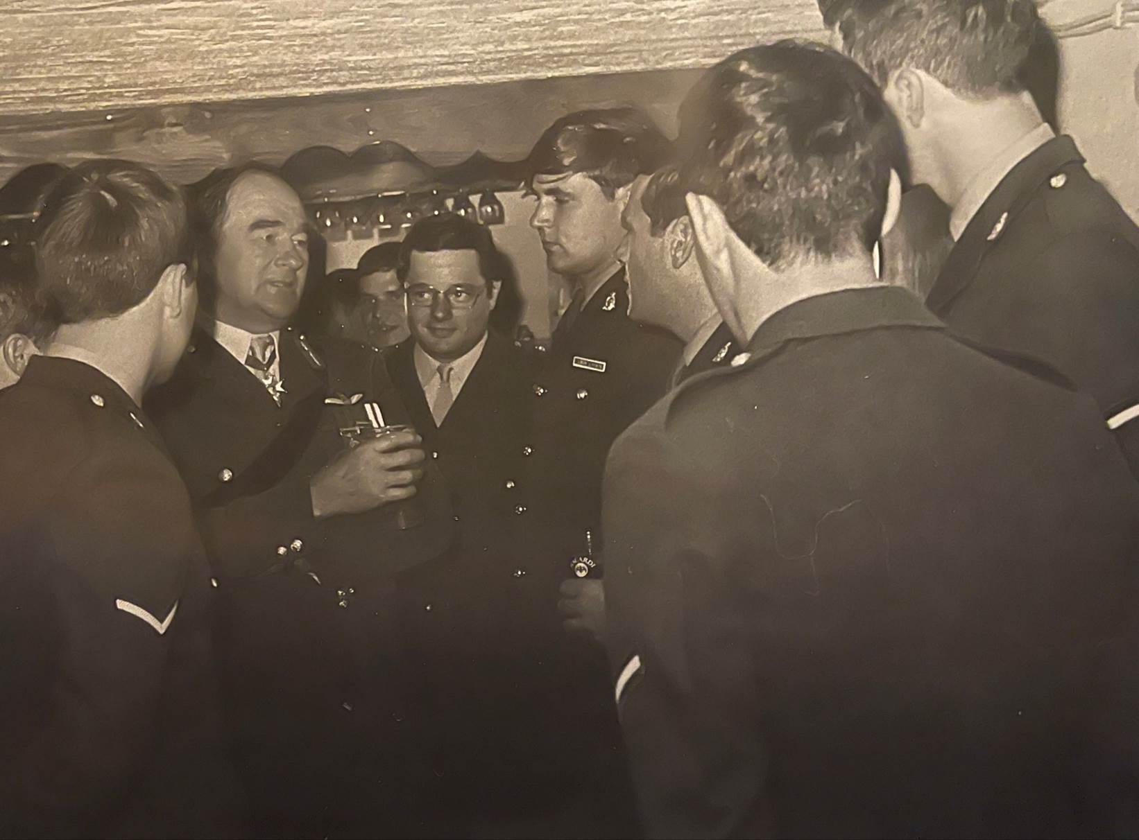 A group of men in a room
Description automatically generated with low confidence