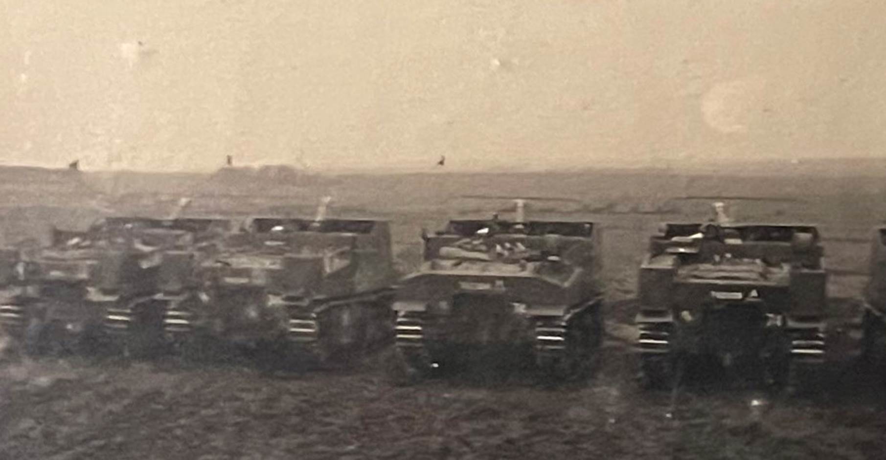 A group of tanks in a field
Description automatically generated with low confidence