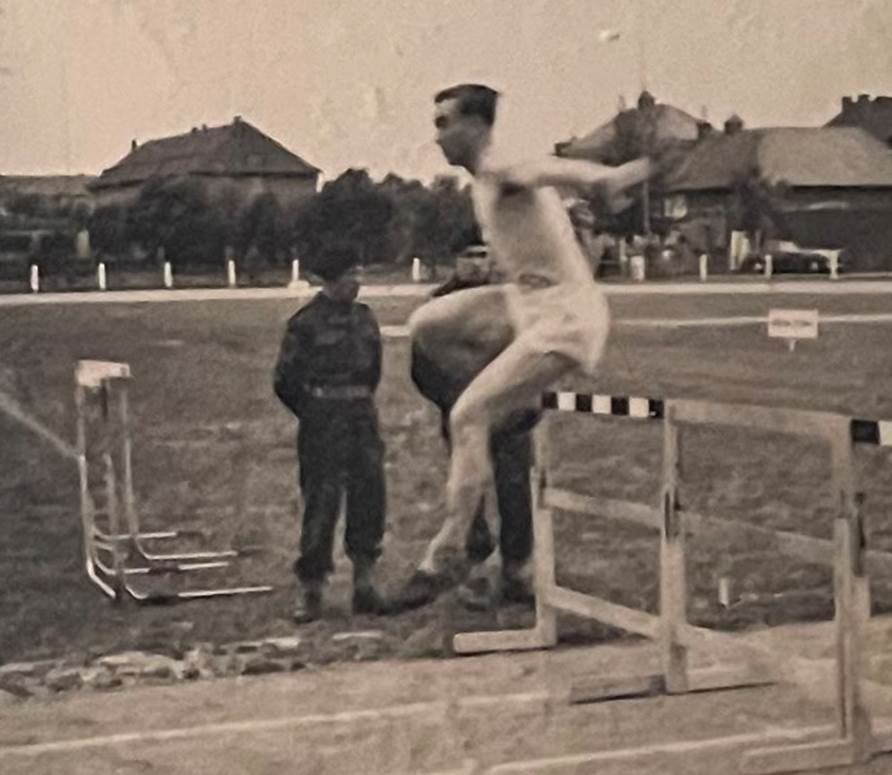 A person jumping over a bar
Description automatically generated with medium confidence