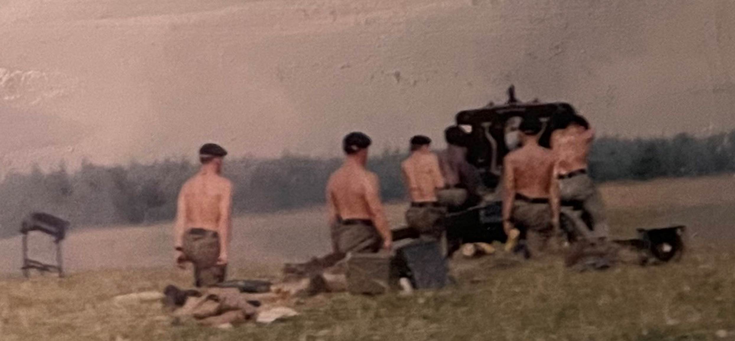 A group of men in a field
Description automatically generated with low confidence