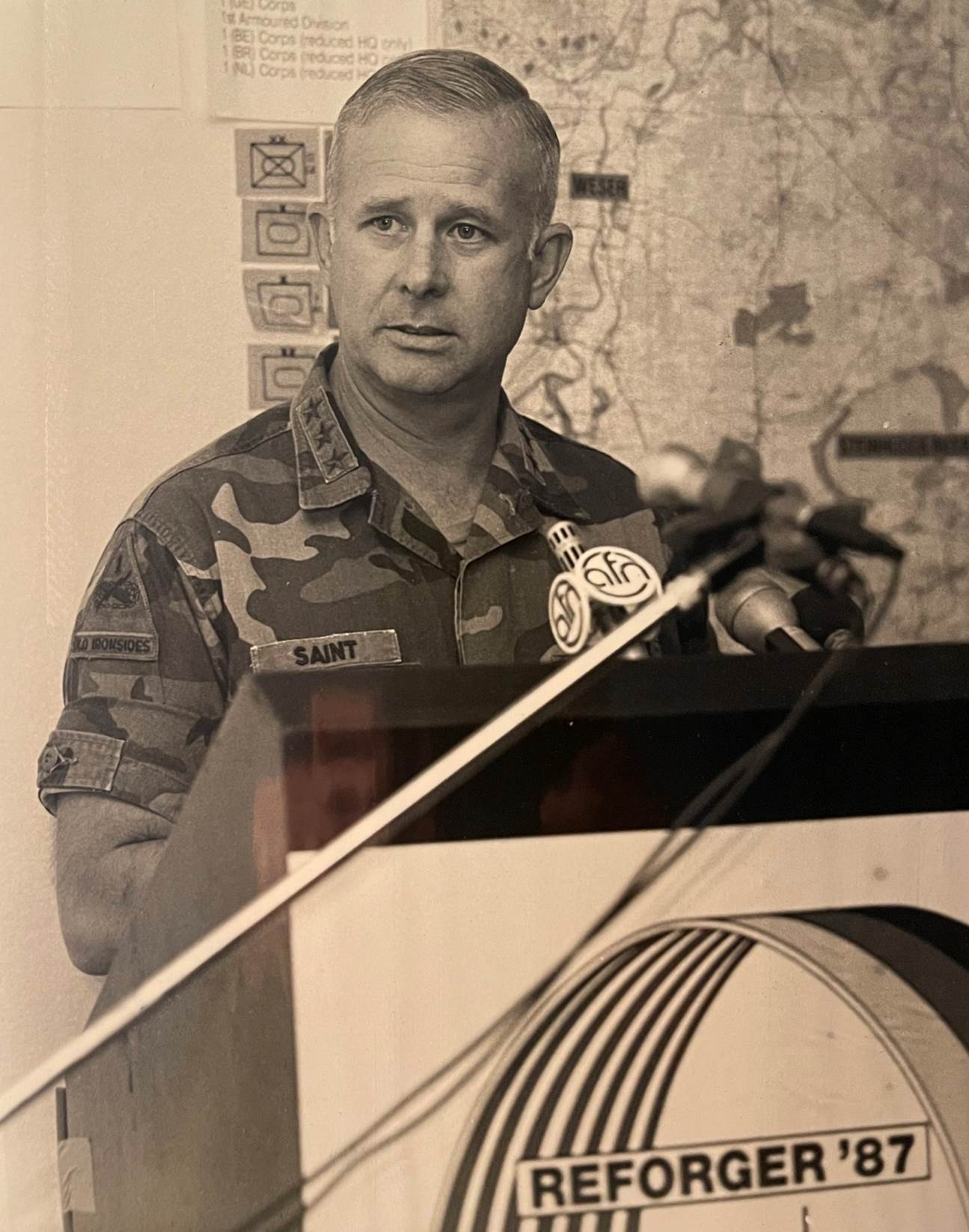 A person in uniform holding an object
Description automatically generated with low confidence
