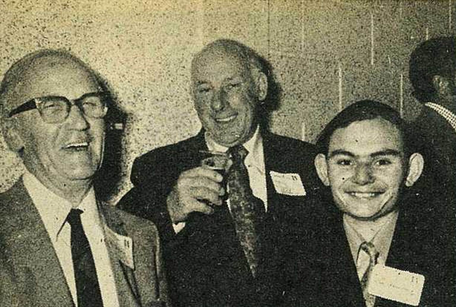 Medium shot of men smiling
Description automatically generated