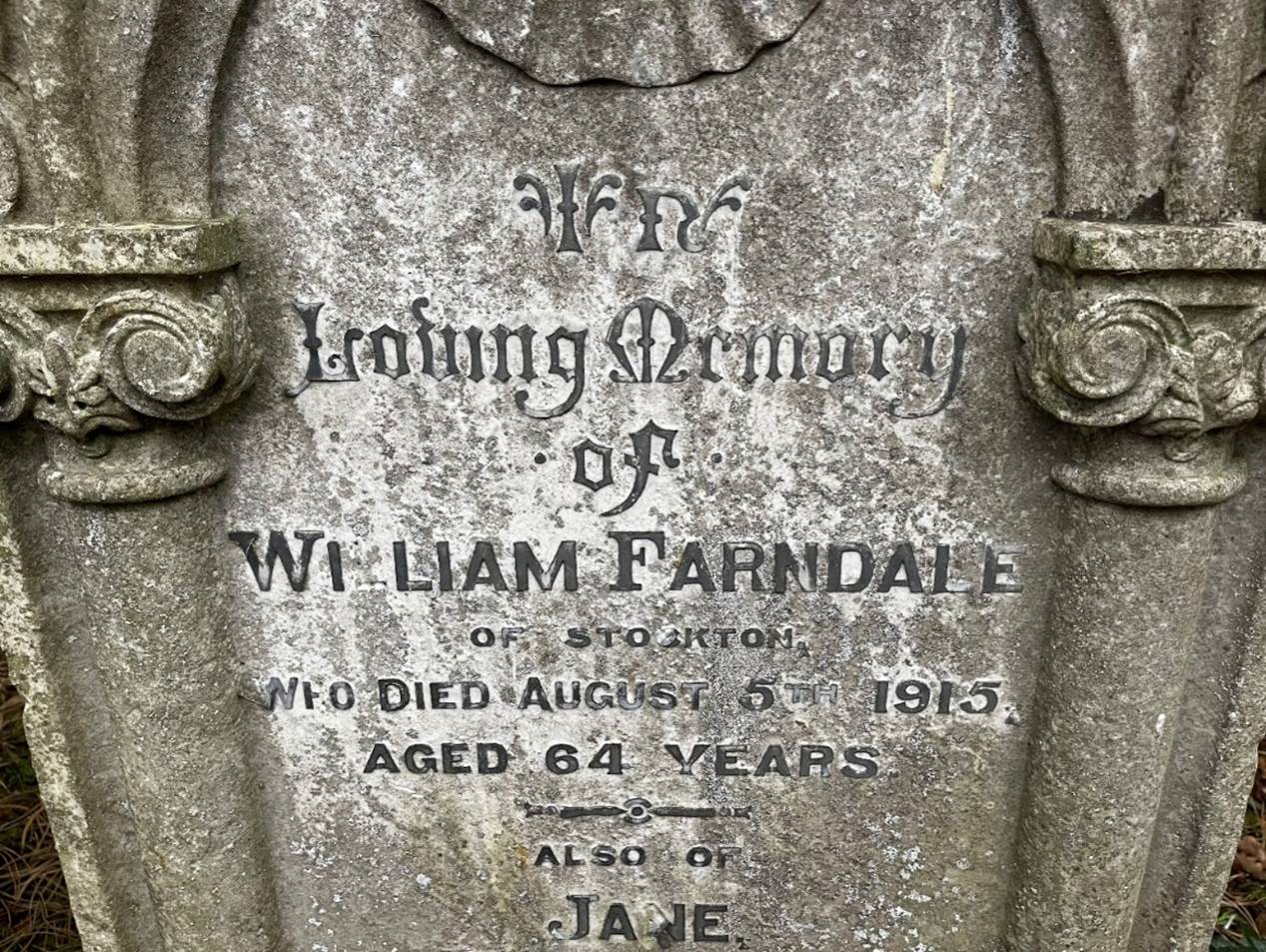 A tombstone with writing on it
Description automatically generated with medium confidence