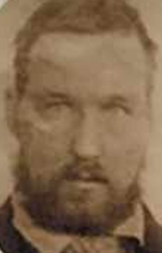 A person with a beard

Description automatically generated