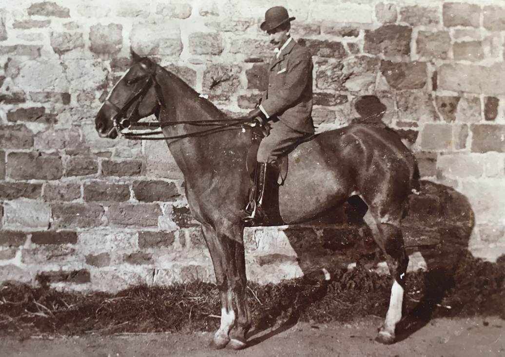 A person riding a horse
Description automatically generated