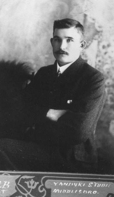 A person with his arms crossed
Description automatically generated