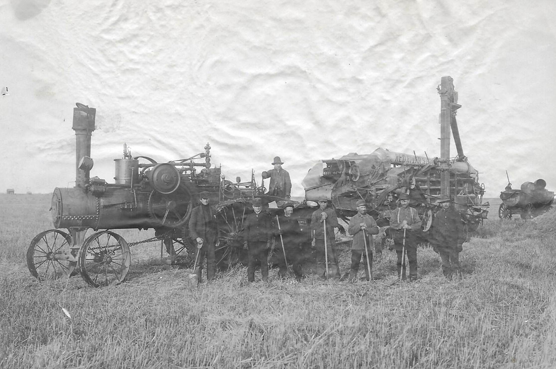 A picture containing photo, grass, old
Description automatically generated