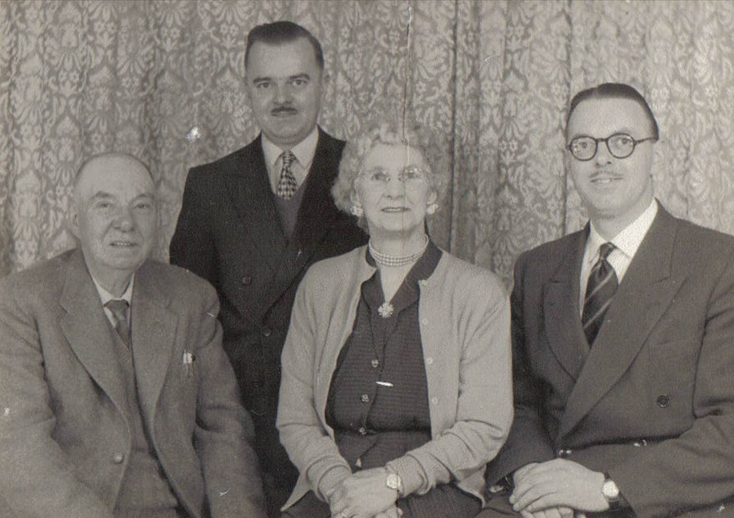 A group of people posing for a photo
Description automatically generated