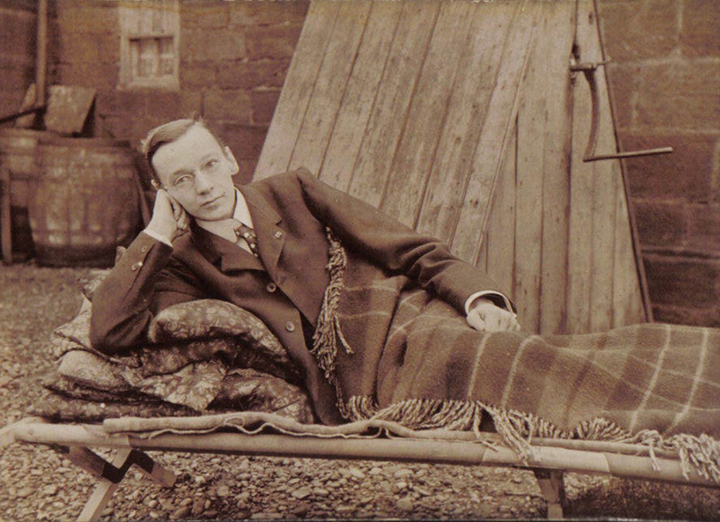A person lying on a blanket
Description automatically generated