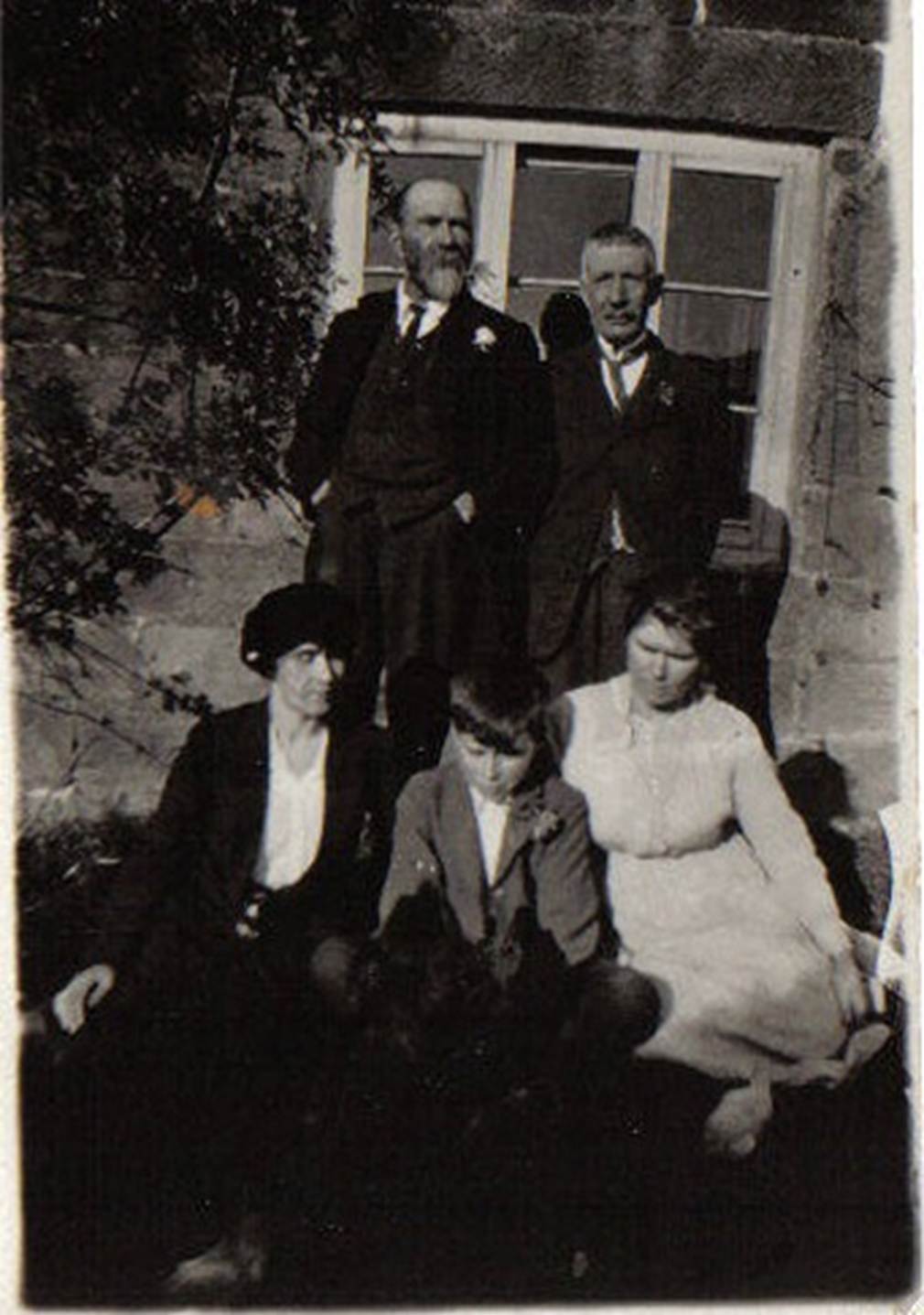 A group of people posing for a photo
Description automatically generated