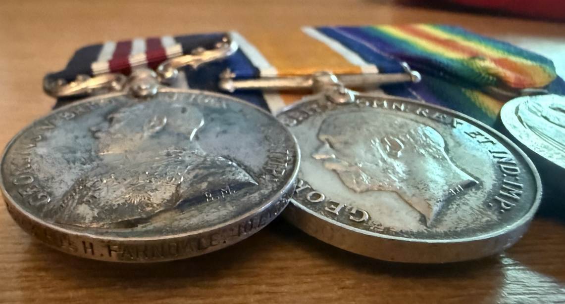 A close-up of a pair of coins

Description automatically generated