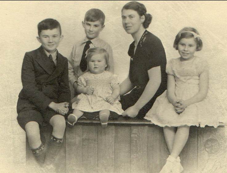 A group of people posing for a photo
Description automatically generated