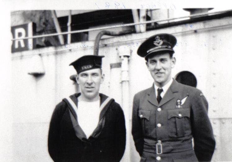 A couple of men in military uniforms
Description automatically generated