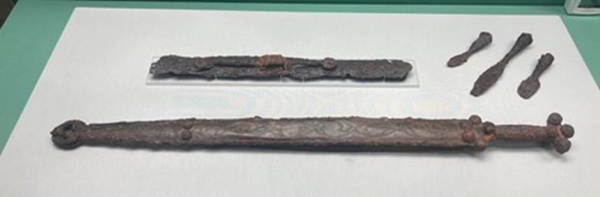 A close up of a sword
Description automatically generated