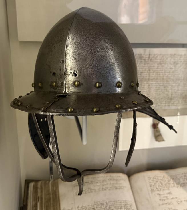 A helmet on a shelf
AI-generated content may be incorrect.
