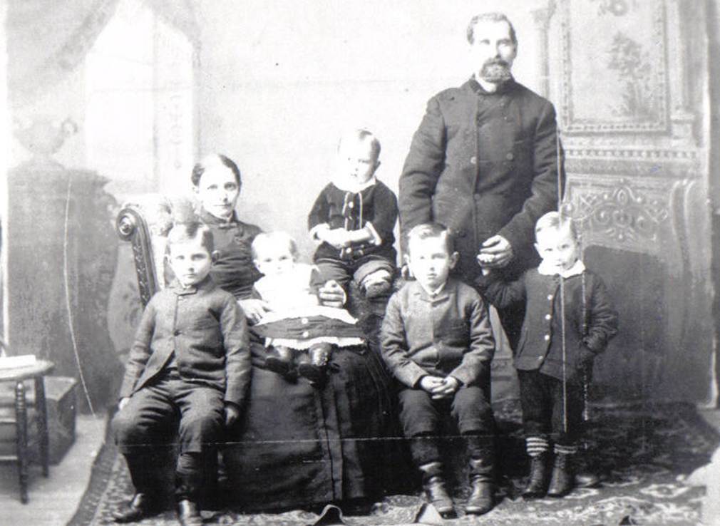 A group of people posing for a photo
Description automatically generated