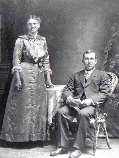 A person and person posing for a picture
Description automatically generated