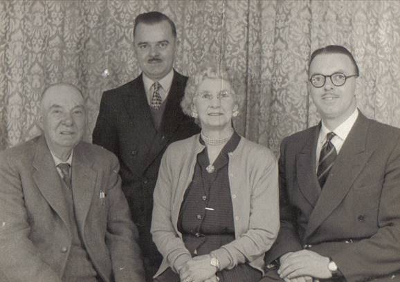 A group of people posing for a photo
Description automatically generated