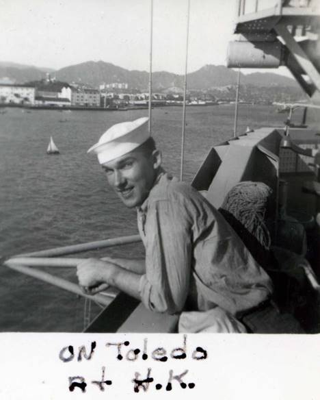 A person in a white hat on a boat
Description automatically generated