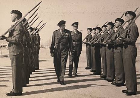 A picture containing text, person, outdoor, military uniform
Description automatically generated