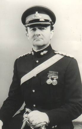 A person in a military uniform
Description automatically generated