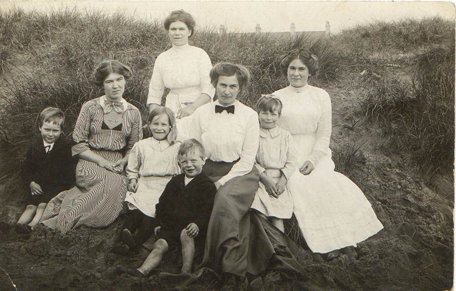 A group of people posing for a photo
Description automatically generated