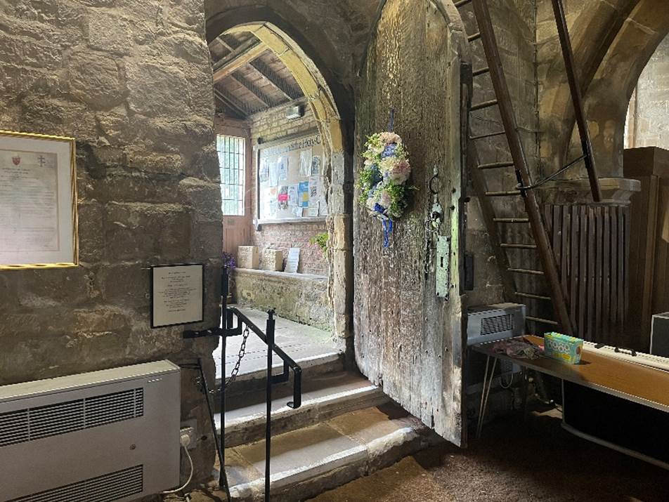 A room with a door open
Description automatically generated