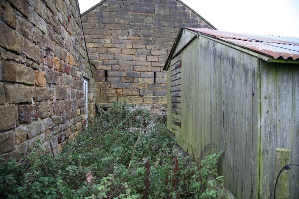 A low angle view of a building
Description automatically generated