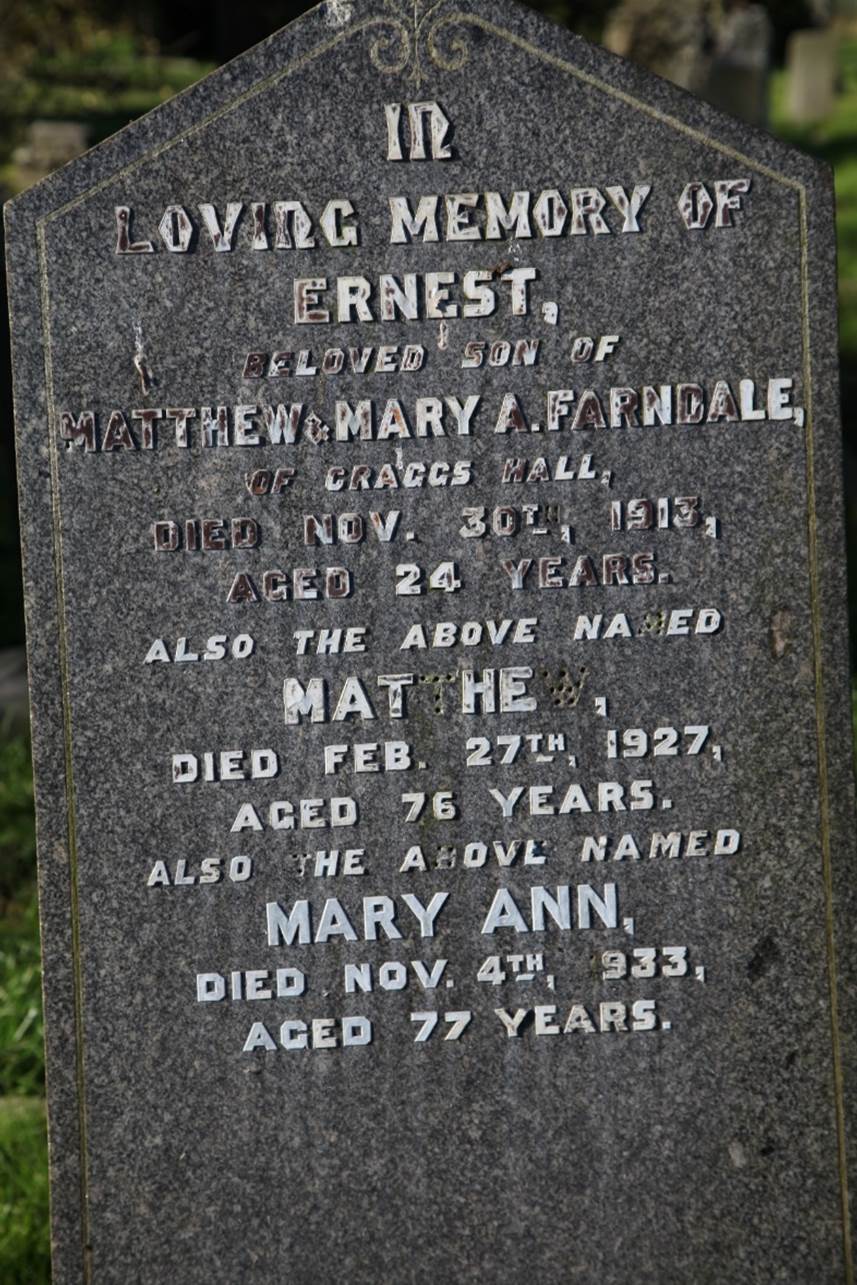 A close-up of a tombstone
Description automatically generated