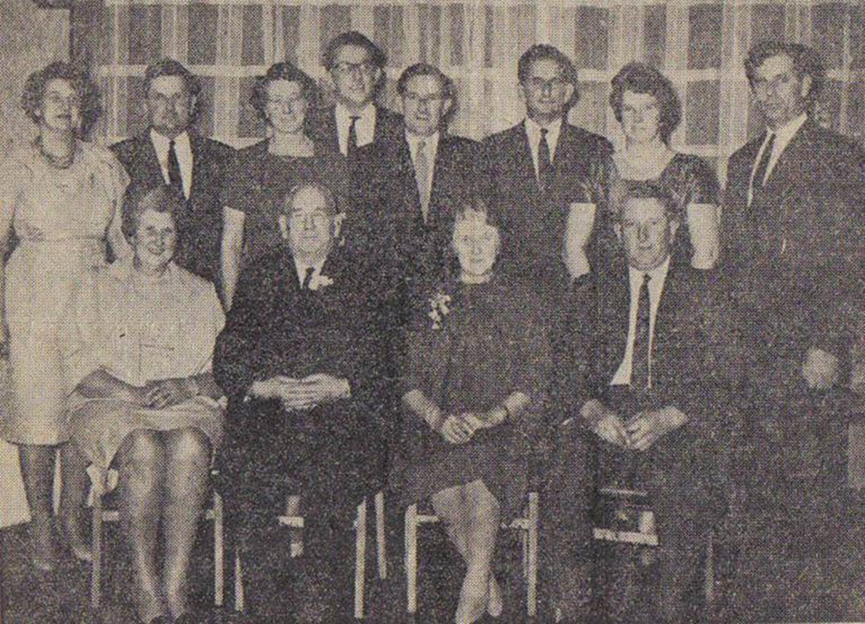 A group of people posing for a photo
Description automatically generated